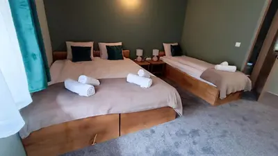 Łóżko lub łóżka w pokoju w obiekcie Pokoje u Daniela