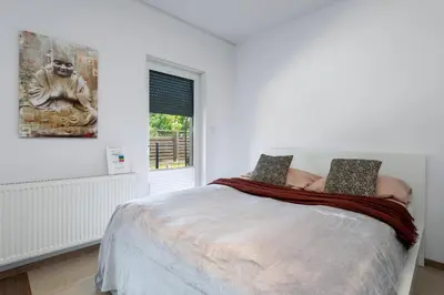 Łóżko lub łóżka w pokoju w obiekcie Apartment Kozielska z pięknym ogrodem i tarasem
