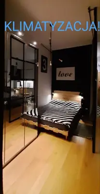 Łóżko lub łóżka w pokoju w obiekcie Apartament DANI