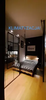 Łóżko lub łóżka w pokoju w obiekcie Apartament DANI