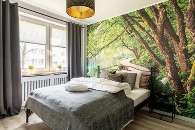 Łóżko lub łóżka w pokoju w obiekcie RentPlanet - Apartament Żytnia