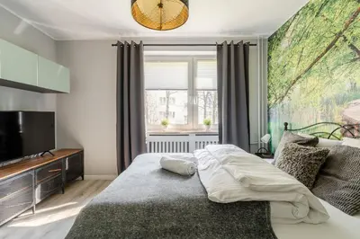 Łóżko lub łóżka w pokoju w obiekcie RentPlanet - Apartament Żytnia