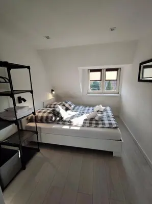 Łóżko lub łóżka w pokoju w obiekcie Apartament Michałowskiego w pobliżu Radiostacji