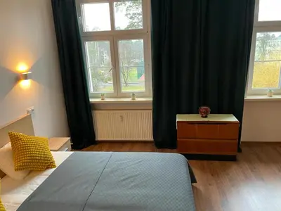 Łóżko lub łóżka w pokoju w obiekcie Apartament Koszary
