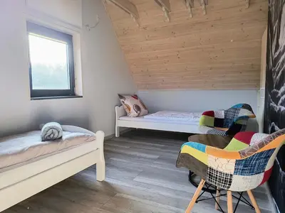 Łóżko lub łóżka w pokoju w obiekcie AB Domki Pstrążna