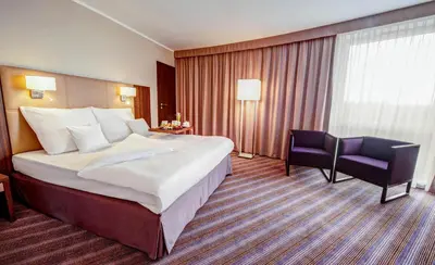 Łóżko lub łóżka w pokoju w obiekcie Hotel DeSilva Premium Opole