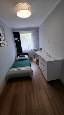 Łóżko lub łóżka w pokoju w obiekcie Zielony Makusz