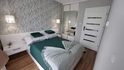 Łóżko lub łóżka w pokoju w obiekcie Zielony Makusz