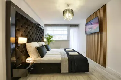 Łóżko lub łóżka w pokoju w obiekcie Apartament Centrum