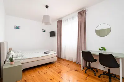Łóżko lub łóżka w pokoju w obiekcie Noclegi Zacisze - Pokoje Gościnne