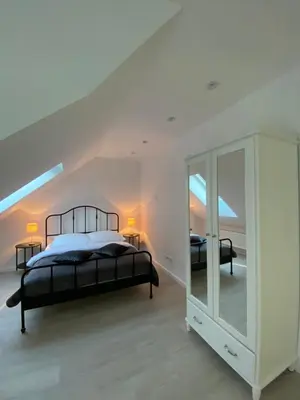 Łóżko lub łóżka w pokoju w obiekcie Apartamenty ARNIKA