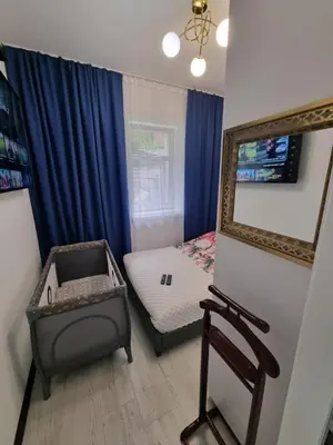 Telewizja i/lub zestaw kina domowego w obiekcie APARTAMENT Jedlinka A