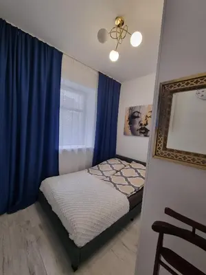 Łóżko lub łóżka w pokoju w obiekcie APARTAMENT Jedlinka A