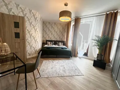 Łóżko lub łóżka w pokoju w obiekcie Apartament Centrum Krawiecka