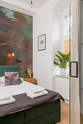 Łóżko lub łóżka w pokoju w obiekcie Prestige Apartments 19