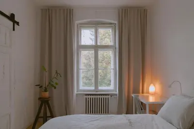 Łóżko lub łóżka w pokoju w obiekcie Alfreda