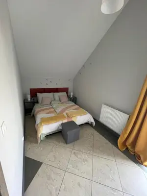 Łóżko lub łóżka w pokoju w obiekcie Apartamenty Świerkowa #2