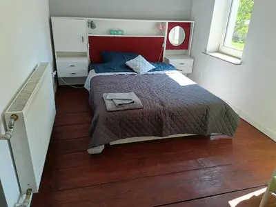 Łóżko lub łóżka w pokoju w obiekcie Dom nad rzeką