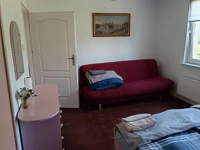 Łóżko lub łóżka w pokoju w obiekcie Dom nad rzeką