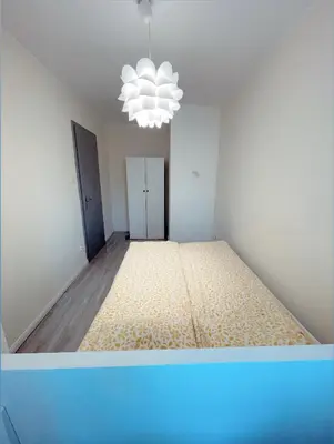 Łóżko lub łóżka w pokoju w obiekcie Apartament w rynku