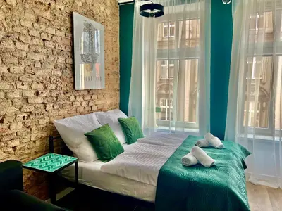 Łóżko lub łóżka w pokoju w obiekcie LOFT Słowackiego