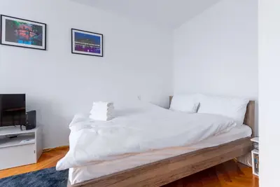 Łóżko lub łóżka w pokoju w obiekcie Rynek Wrocław Cosy Studio by BookingHost