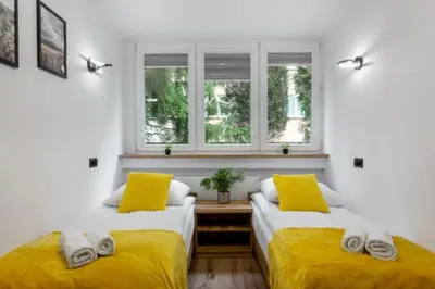 Łóżko lub łóżka w pokoju w obiekcie Apartament Pogodny Lazur