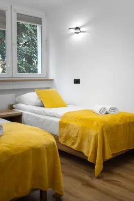Łóżko lub łóżka w pokoju w obiekcie Apartament Pogodny Lazur