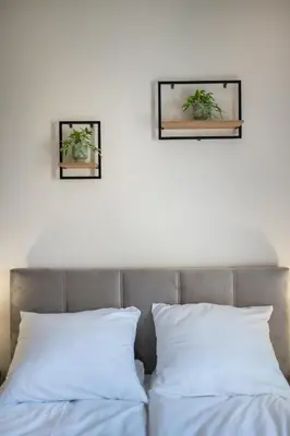 Łóżko lub łóżka w pokoju w obiekcie Apartament Lompy