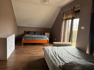Łóżko lub łóżka w pokoju w obiekcie Dom Krotoszyce