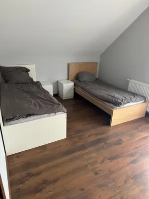 Łóżko lub łóżka w pokoju w obiekcie Dom Krotoszyce