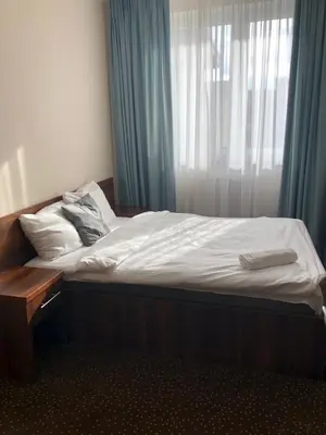 Łóżko lub łóżka w pokoju w obiekcie NOCLEGI Kolonia Wokulskiego 4