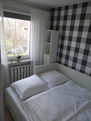 Łóżko lub łóżka w pokoju w obiekcie Apartament Malinka