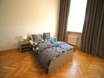 Łóżko lub łóżka w pokoju w obiekcie HAPPYESTATE ul Rynek 20 Old Town