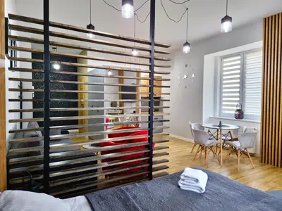 Łóżko lub łóżka w pokoju w obiekcie Wieczorek Apartment