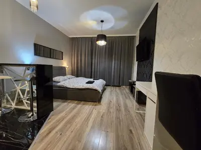 Łóżko lub łóżka w pokoju w obiekcie HAPPYESTATE ul Podwale OVO Old Town