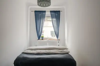 Łóżko lub łóżka w pokoju w obiekcie RentPlanet - Apartamenty Cybulskiego II