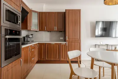 Kuchnia lub aneks kuchenny w obiekcie RentPlanet - Apartamenty Cybulskiego II
