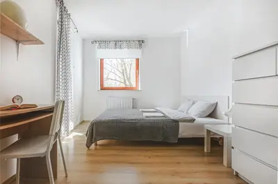 Łóżko lub łóżka w pokoju w obiekcie Komfort Parking Balkon