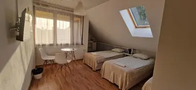 Łóżko lub łóżka w pokoju w obiekcie Hostel Milicka
