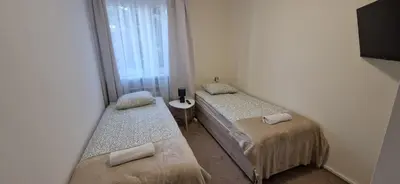 Łóżko lub łóżka w pokoju w obiekcie Hostel Milicka