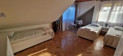 Łóżko lub łóżka w pokoju w obiekcie Hostel Milicka