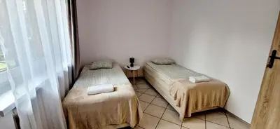 Łóżko lub łóżka w pokoju w obiekcie Hostel Milicka