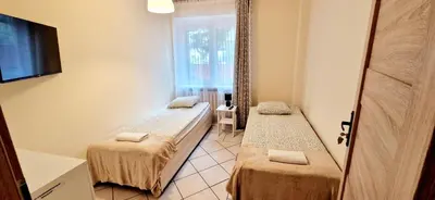 Łóżko lub łóżka w pokoju w obiekcie Hostel Milicka