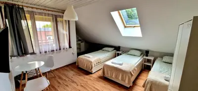 Łóżko lub łóżka w pokoju w obiekcie Hostel Milicka