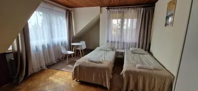 Łóżko lub łóżka w pokoju w obiekcie Hostel Milicka