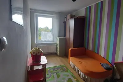 Łóżko lub łóżka w pokoju w obiekcie HarmonyHub