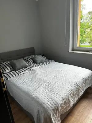 Łóżko lub łóżka w pokoju w obiekcie Apartament Helenka