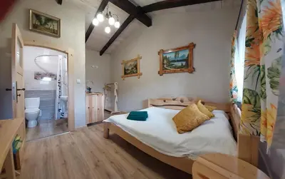 Łóżko lub łóżka w pokoju w obiekcie Stary Spichlerz nad Wartą