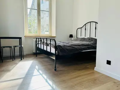 Łóżko lub łóżka w pokoju w obiekcie Apartamenty Maj Sokołowsko